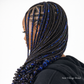 Woman with blue and black braided hair on a white background, with 'New Village Braid' branding.