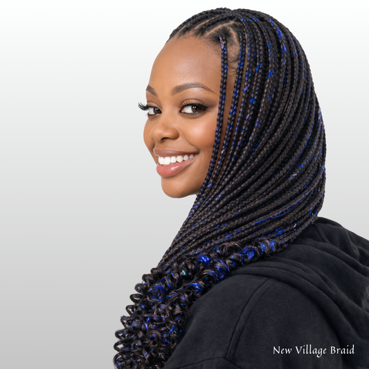 Woman with blue and black non-toxic braided hair wearing a black hoodie on a light gray background